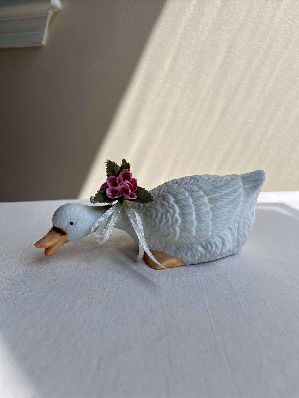 Vintage White Ceramic Goose Figurine with Pink Floral Ribbon Accent